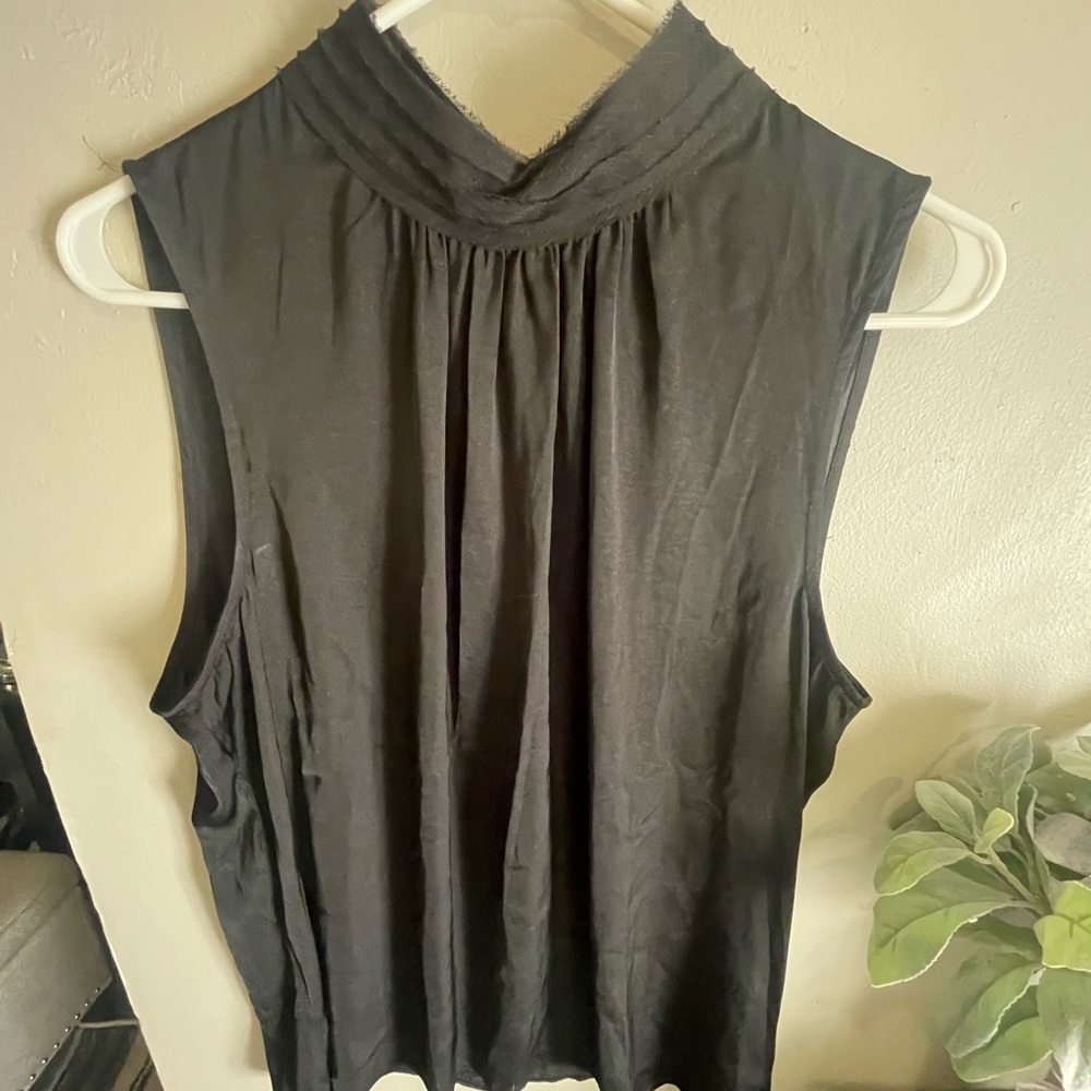 High neck black top.